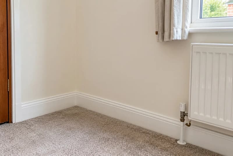 Illustrative freshly replastered wall in a UK home