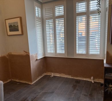 Replastered bay window wall
